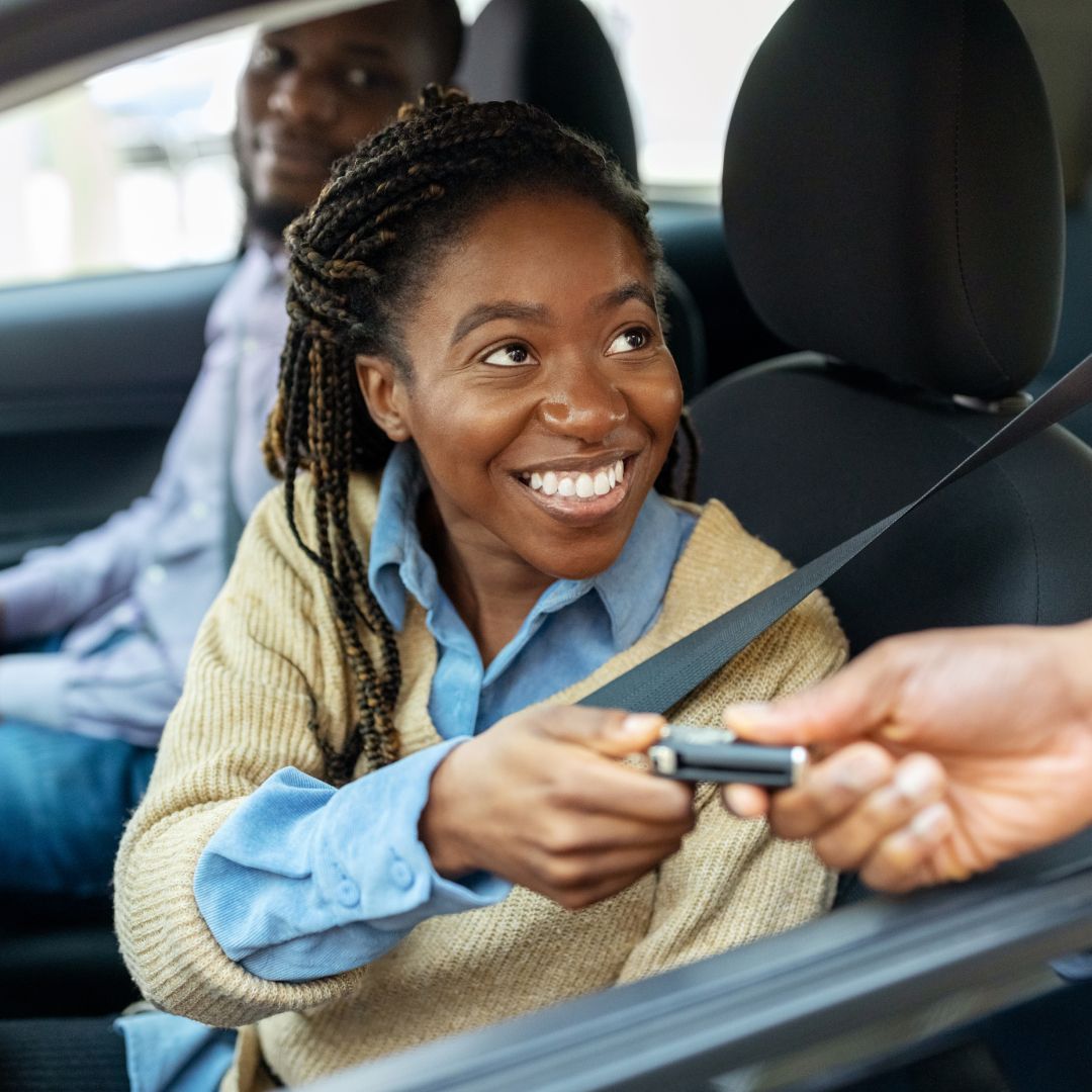 Happy buyer receiving verified car keys